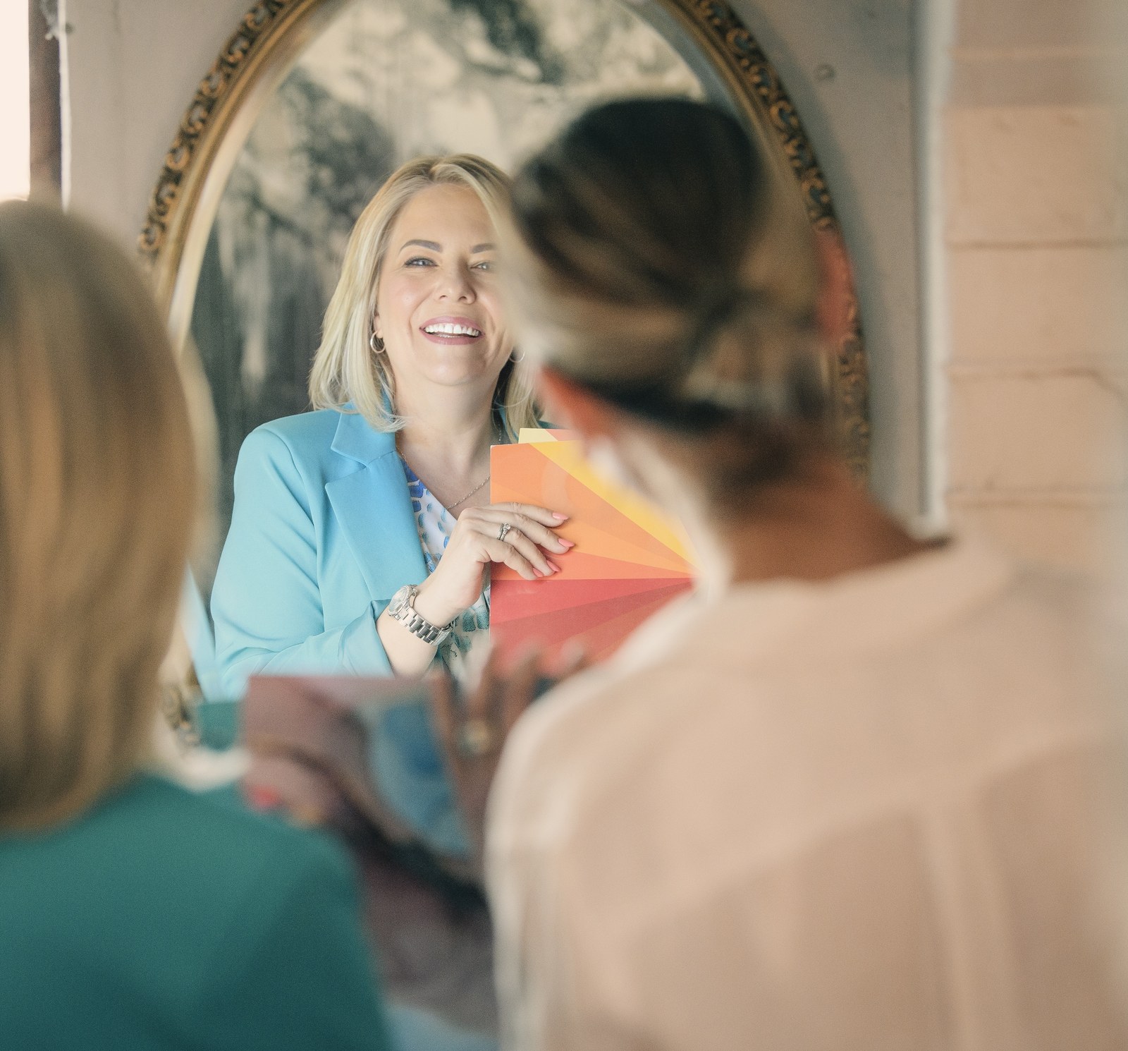 Helga Jackson holding colour swatches during a personal colour consultation
